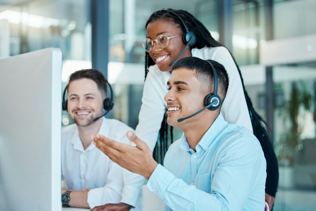 Telemarketing, training and black woman coaching team of men at customer service agency. Diversity,