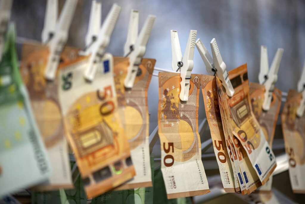 100 and 50 euro banknotes drying. Washed Euro paper bills. Drying euro on a string.Money laundering.